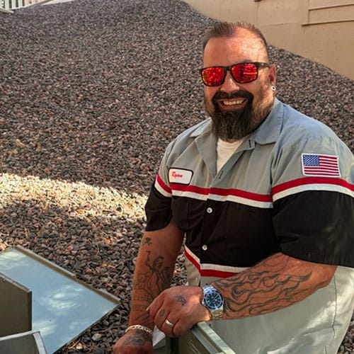 TradeKinetics HVAC technician servicing a furnace in a Denver home
